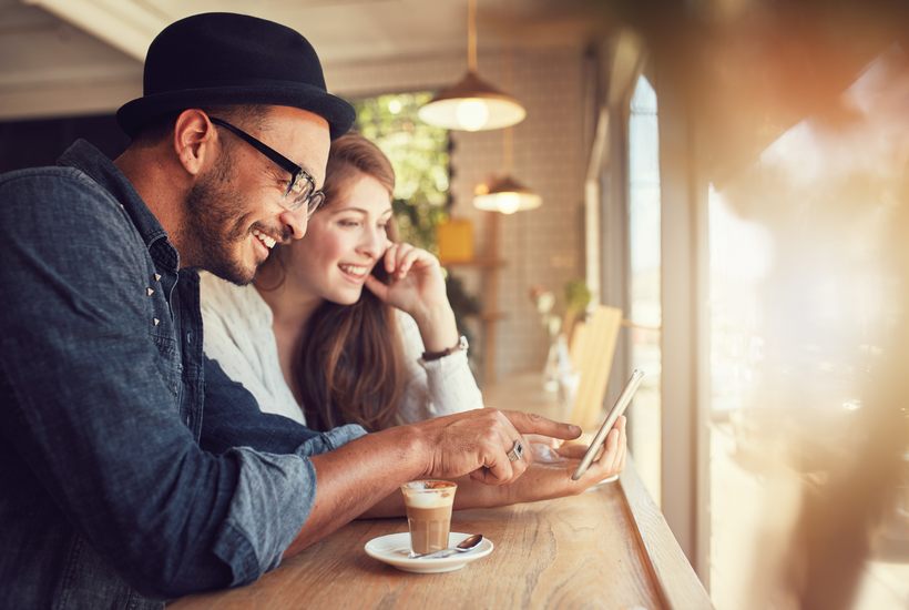 Couple Relaxing In A Cafe